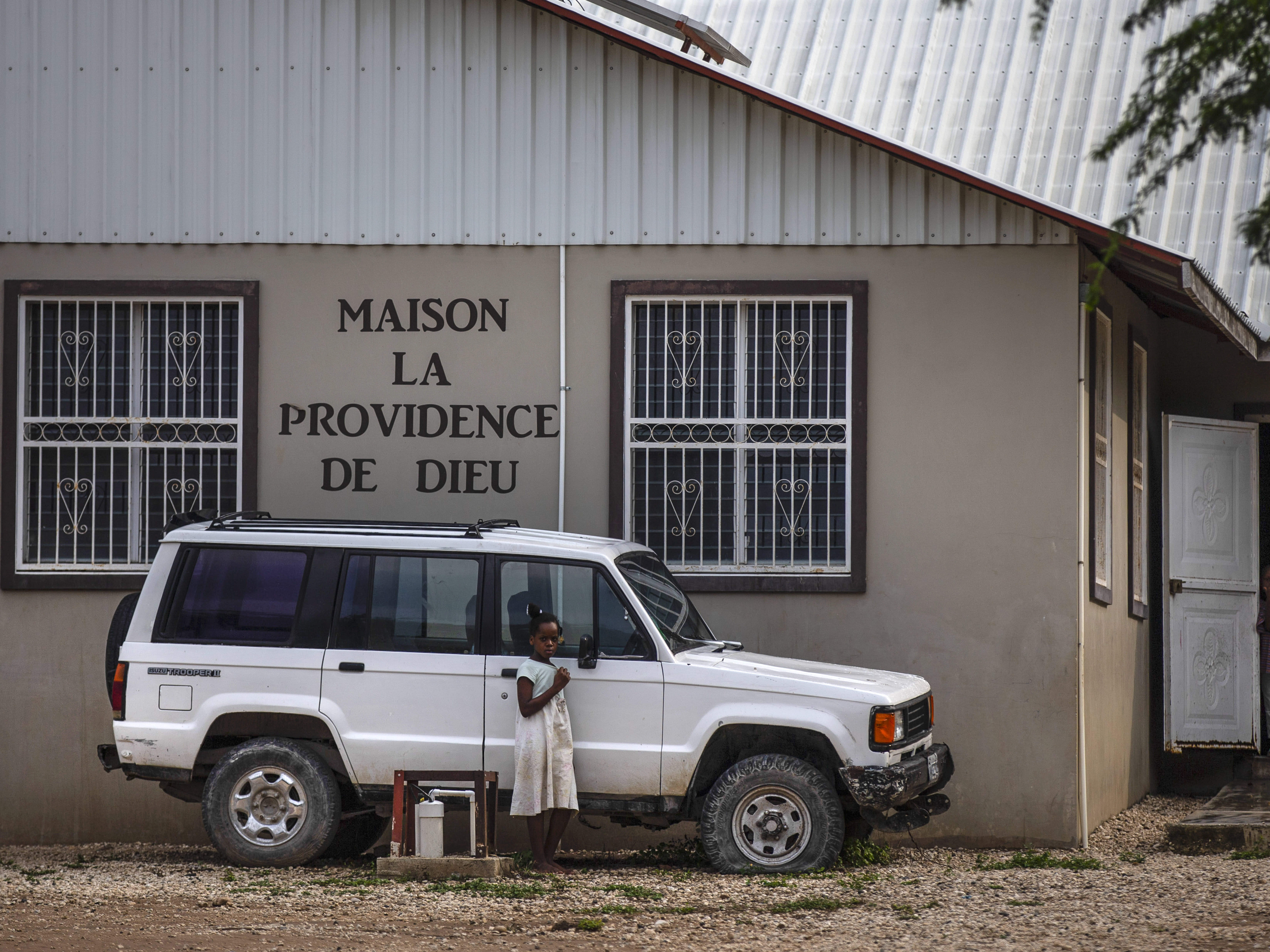 caption: Children stand in the courtyard of the Maison La Providence de Dieu orphanage it Ganthier, Croix-des-Bouquets, Haiti, Sunday, Oct. 17, 2021, where a gang abducted 17 missionaries from a U.S.-based organization. The 400 Mawozo gang, notorious for brazen kidnappings and killings took the group of 16 U.S. citizens and one Canadian, after a trip to visit the orphanage.