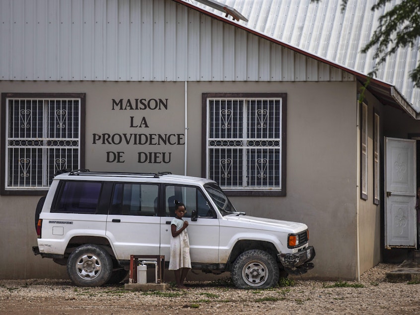 caption: Children stand in the courtyard of the Maison La Providence de Dieu orphanage it Ganthier, Croix-des-Bouquets, Haiti, Sunday, Oct. 17, 2021, where a gang abducted 17 missionaries from a U.S.-based organization. The 400 Mawozo gang, notorious for brazen kidnappings and killings took the group of 16 U.S. citizens and one Canadian, after a trip to visit the orphanage.