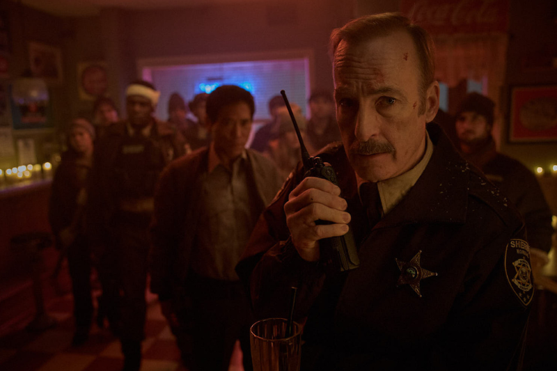 caption: Peter Shinkoda is Joe, and Bob Odenkirk stars as Sheriff Ulysses in "Normal." 