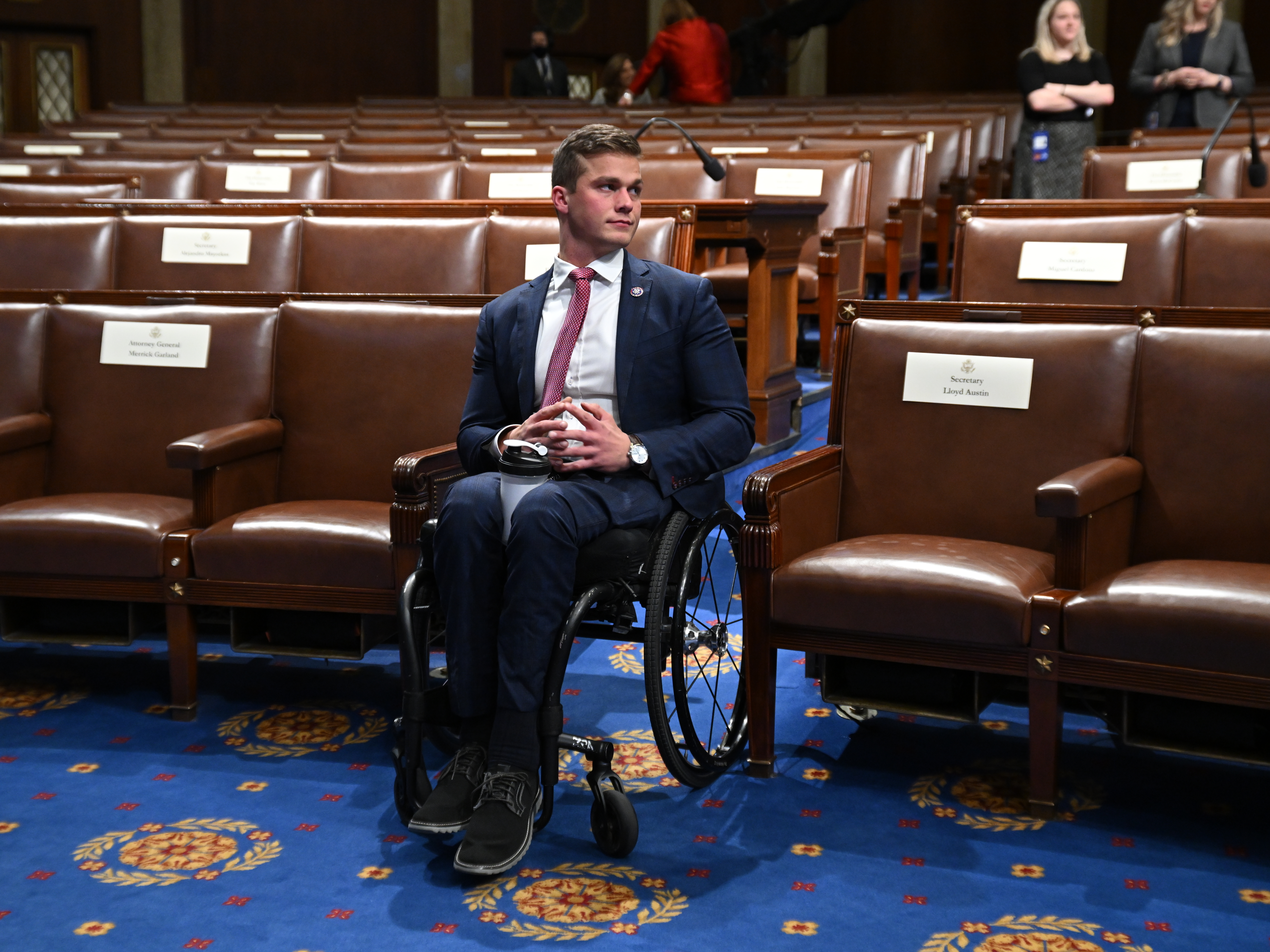 caption: Rep. Madison Cawthorn, R-N.C., seen here waiting for the State of the Union address in March, faces allegations of insider trading related to an anti-Biden cryptocurrency and of having an inappropriate financial relationship with a staffer.