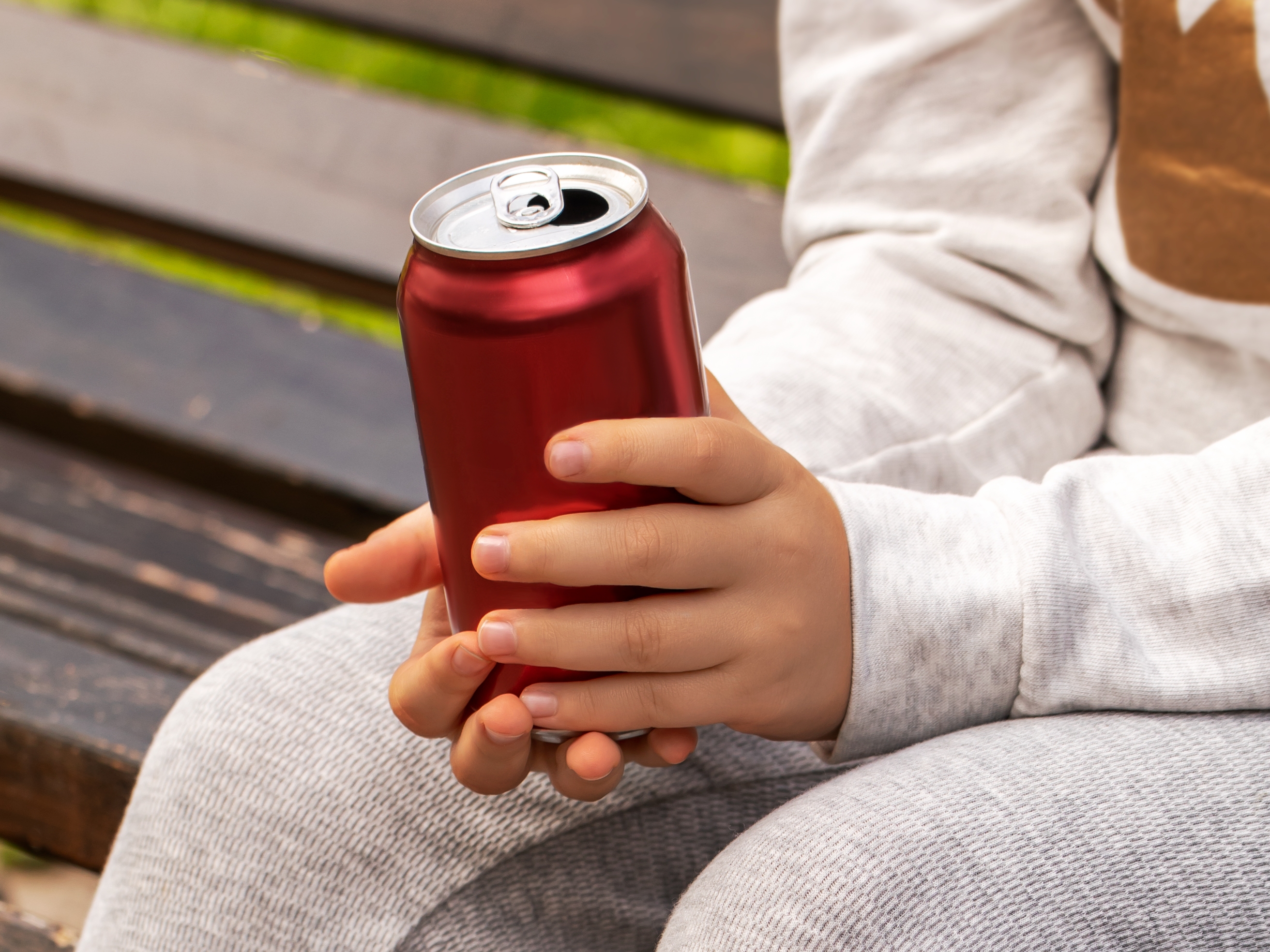 caption: Energy drinks, which have become very popular with kids and adolescents, often contain added sugars and large amounts of caffeine.
