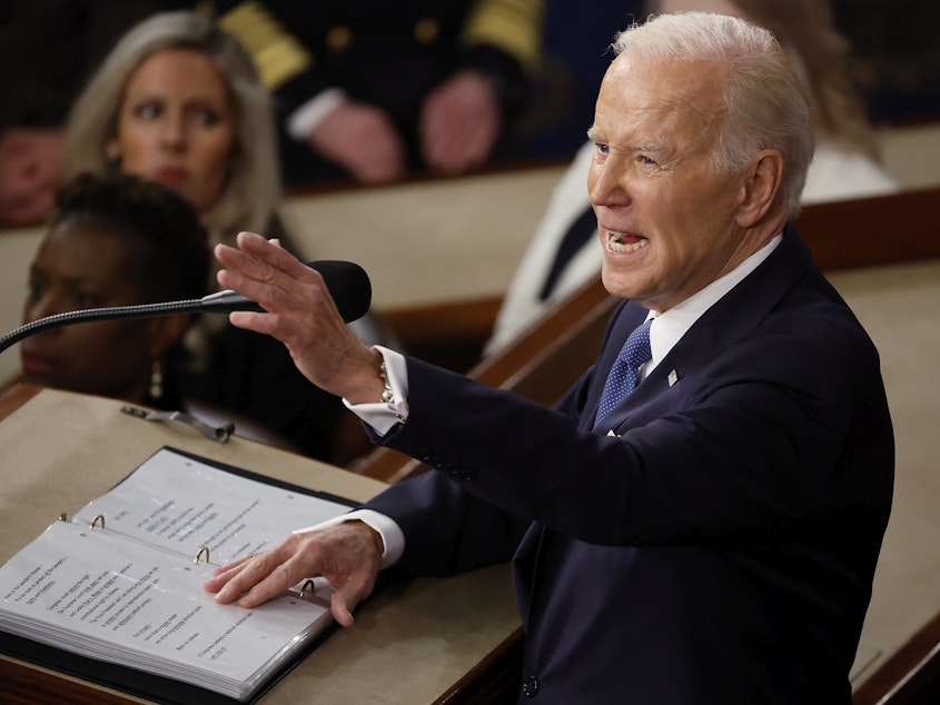 caption: Joe Biden delivers the State of the Union address last February.