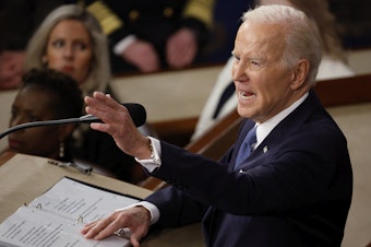caption: Joe Biden delivers the State of the Union address last February.