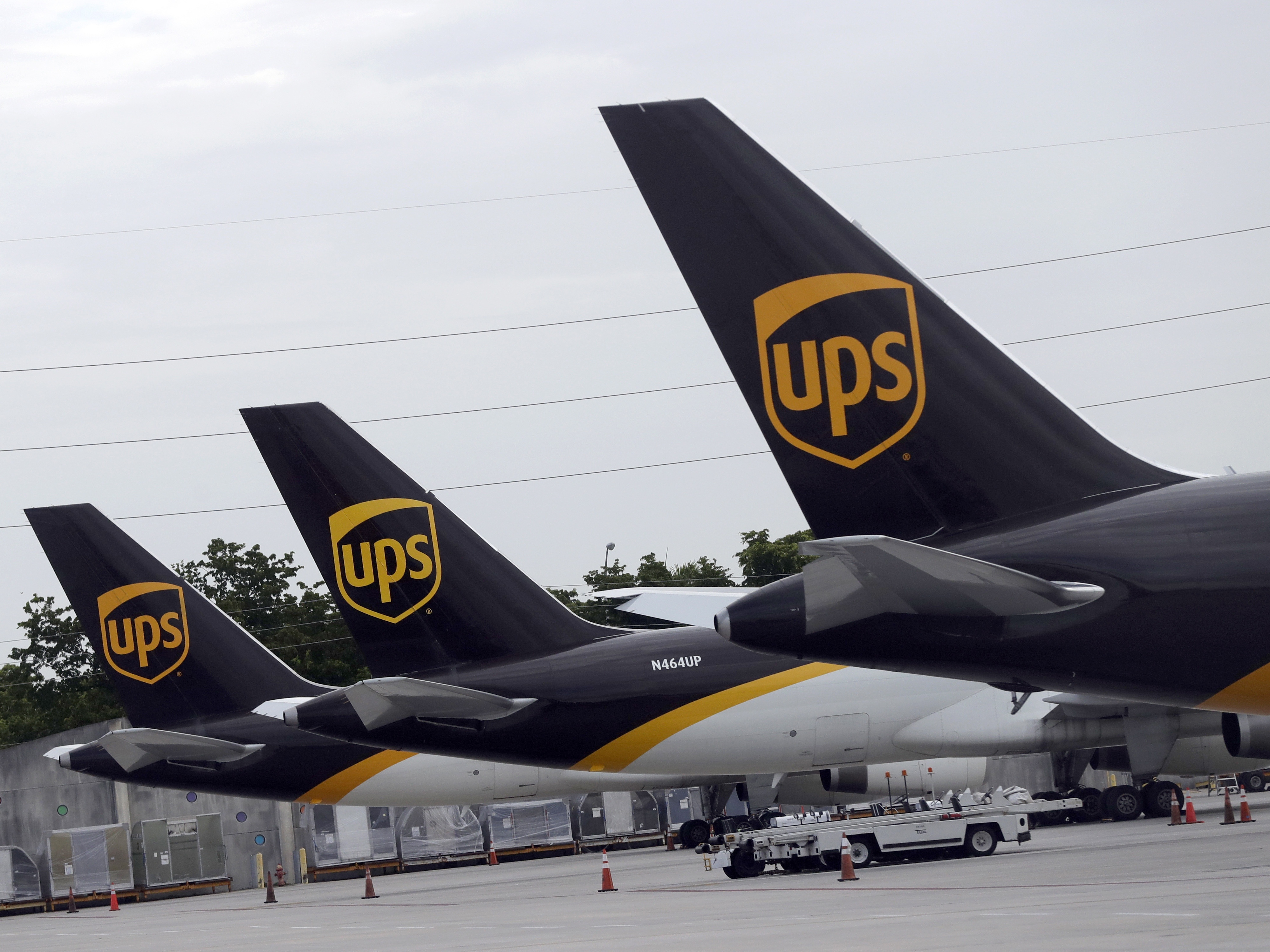 caption: In this July 27, 2020, file photo, the tails of three UPS aircraft are shown parked at Miami International Airport in Miami.