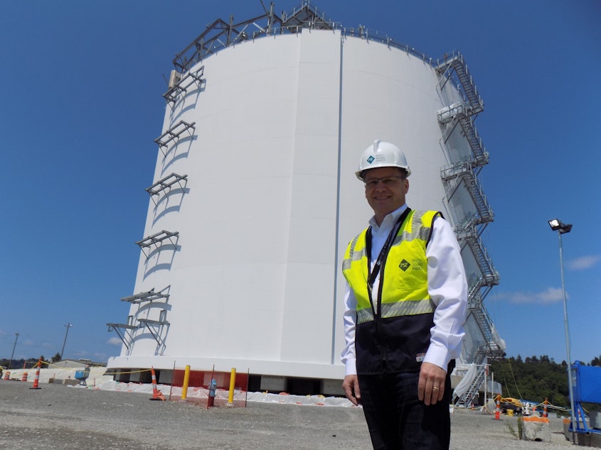 caption: Puget Sound Energy spokesperson Andy Wappler in front of the company's 8 million gallon liquid natural gas tank in Tacoma.