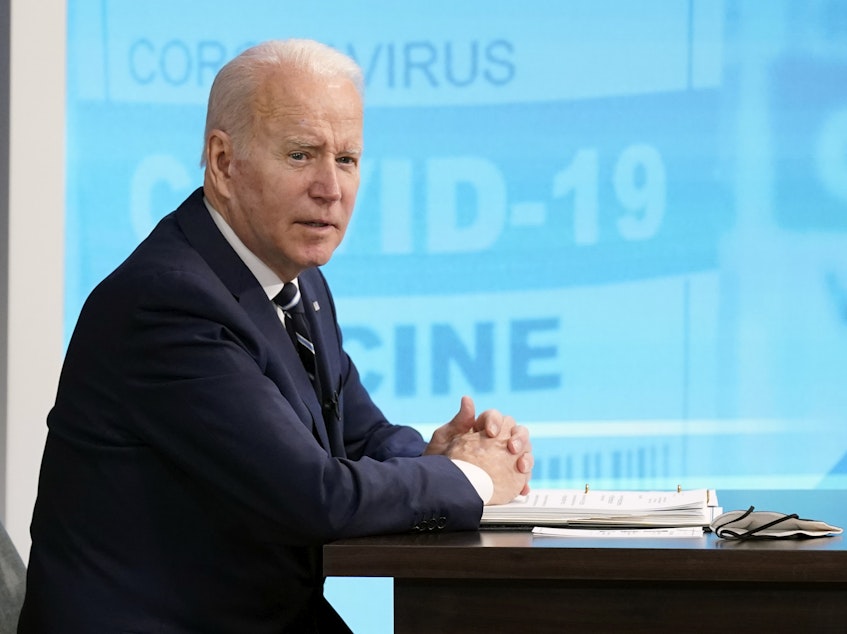 caption: President Joe Biden speaks about the government's COVID-19 response, Jan. 13, 2022. Experts say his administration's efforts have yielded mixed results in the first year Biden's been in office.