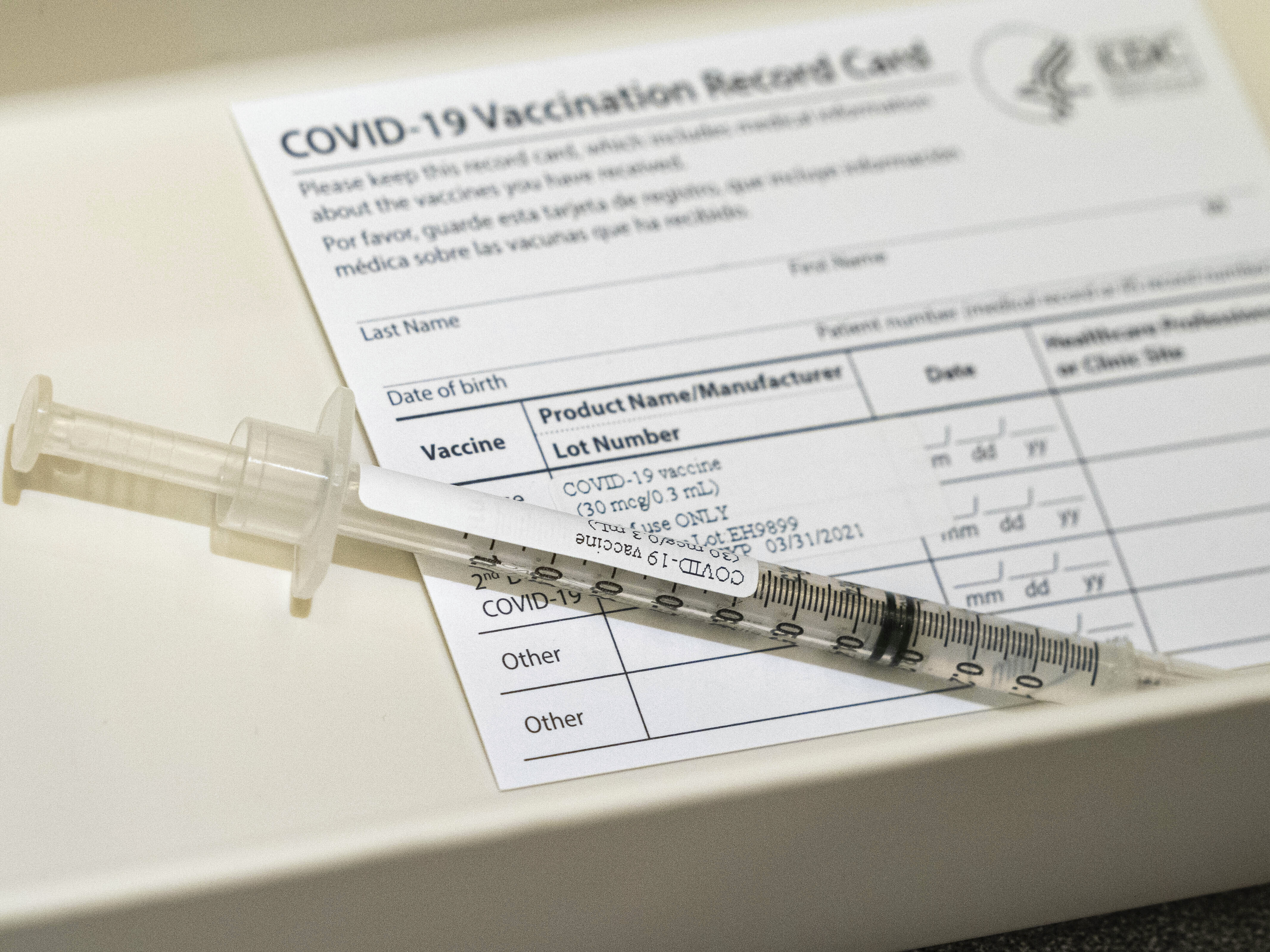 caption: A syringe containing a dose of a Pfizer-BioNtech COVID-19 vaccine sits in a container, during a vaccine clinic at Providence Alaska Medical Center in Anchorage, Alaska. The state has become the first in the nation to offer the COVID-19 vaccine to any resident 16 or older.