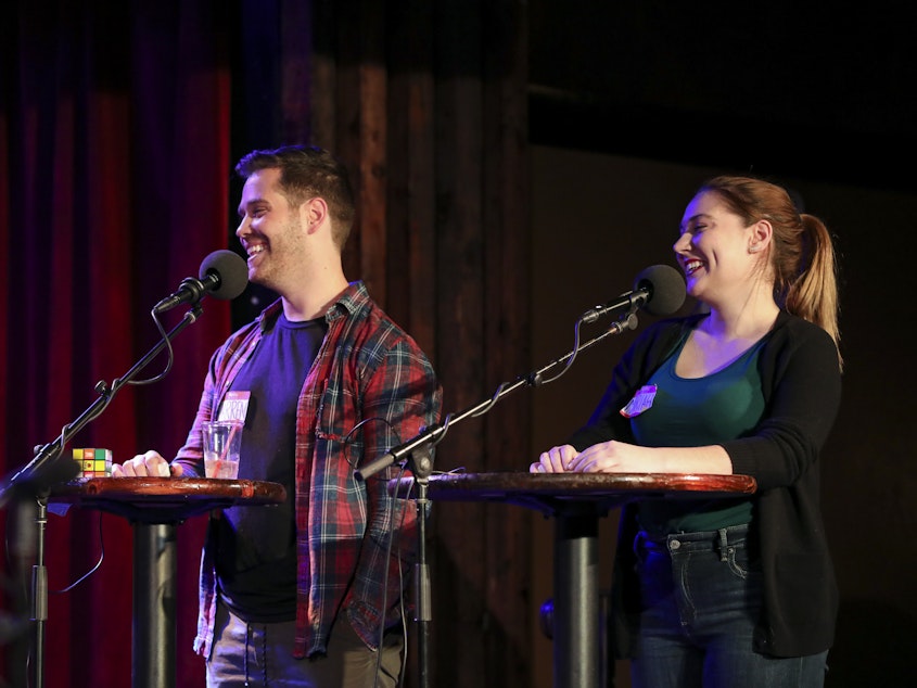 caption: Contestants compete in the final round on <em>Ask Me Another</em> at the Bell House in Brooklyn, New York.