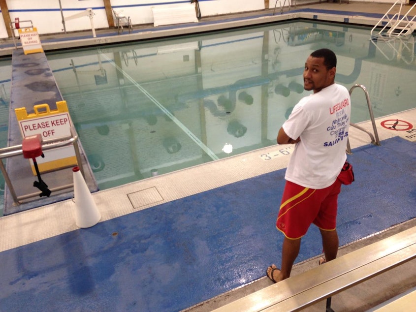 caption: Alvin Barnes, a swim teacher at Helene Madison Pool in North Seattle. The question children ask the most when they see him: "Can you swim?" (His answer: "No, but I read a book.")