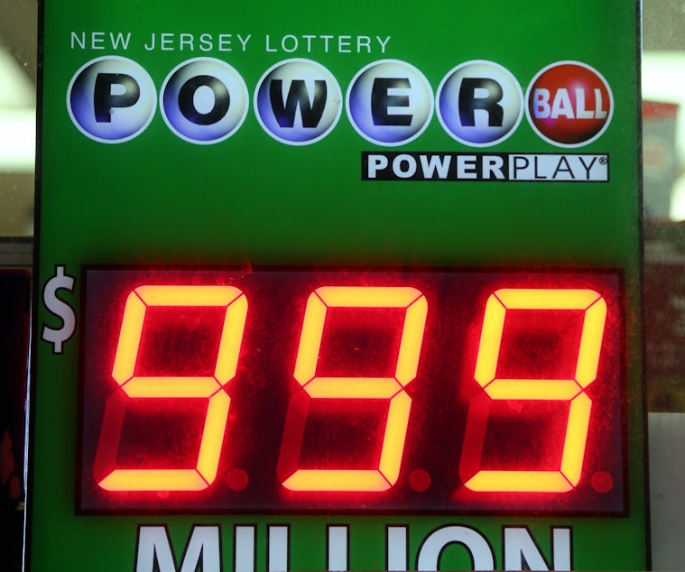 caption: A Powerball sign can't accommodate a figure larger than $999 million.