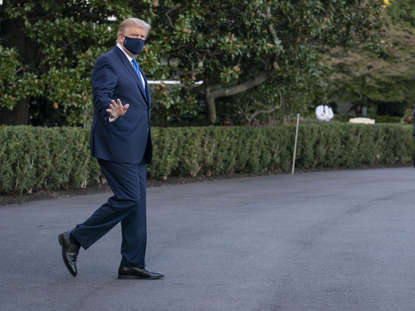 caption: U.S. President Donald Trump before being taken to Walter Reed National Military Medical Center.