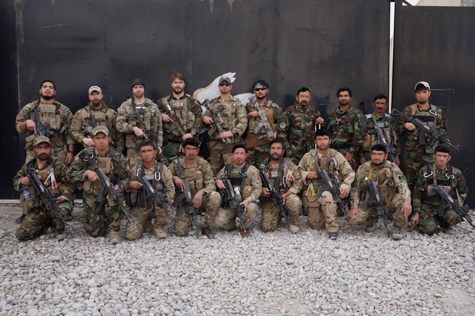 caption: Team 11 was a group working with the U.S. Army Special Forces to clear IEDs in Afghanistan operations.