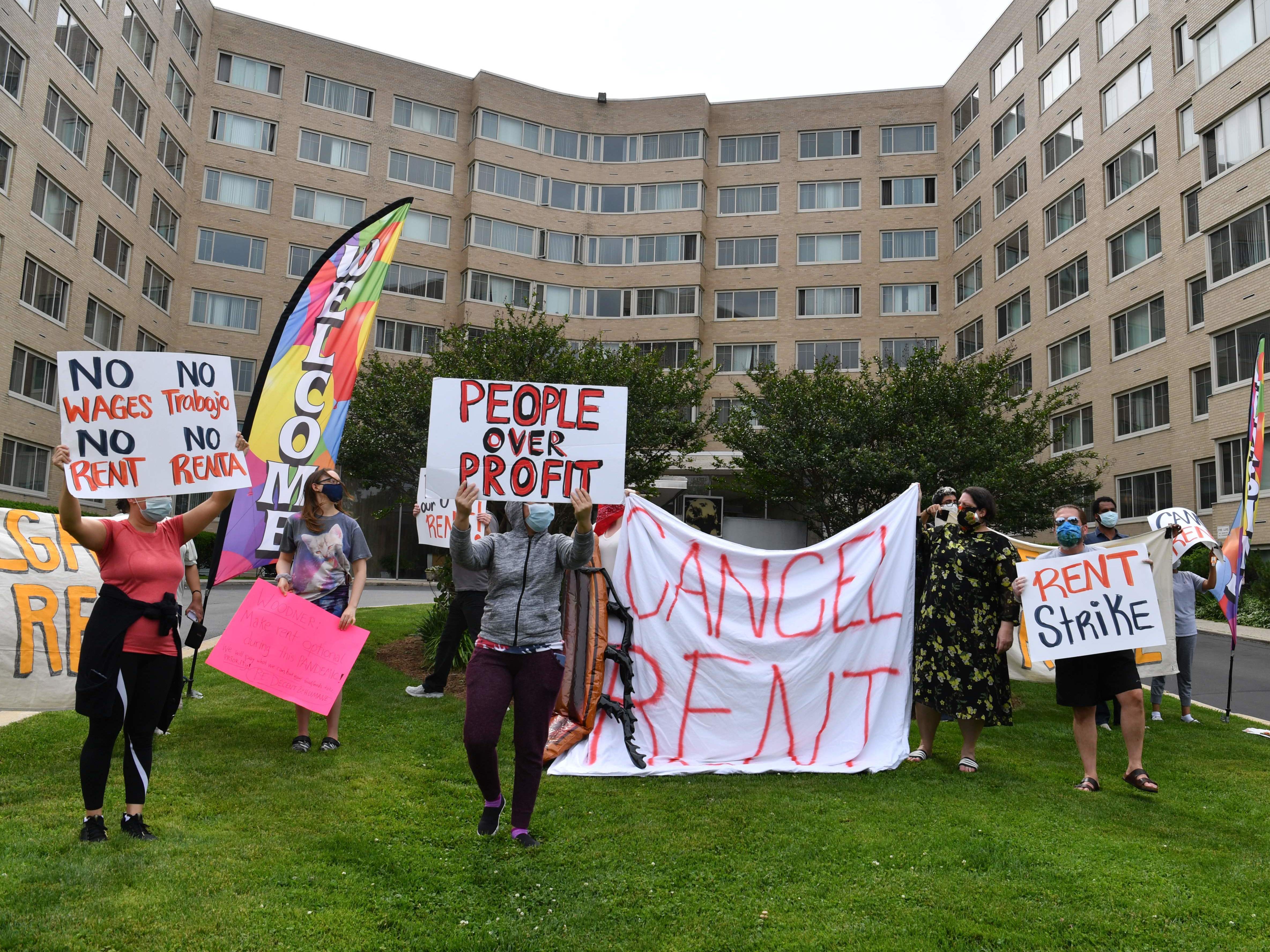 caption: Renters in the Woodner apartment building in Washington, D.C., protest to demand their rent be forgiven during the COVID-19 pandemic on May 28.