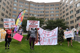caption: Renters in the Woodner apartment building in Washington, D.C., protest to demand their rent be forgiven during the COVID-19 pandemic on May 28.