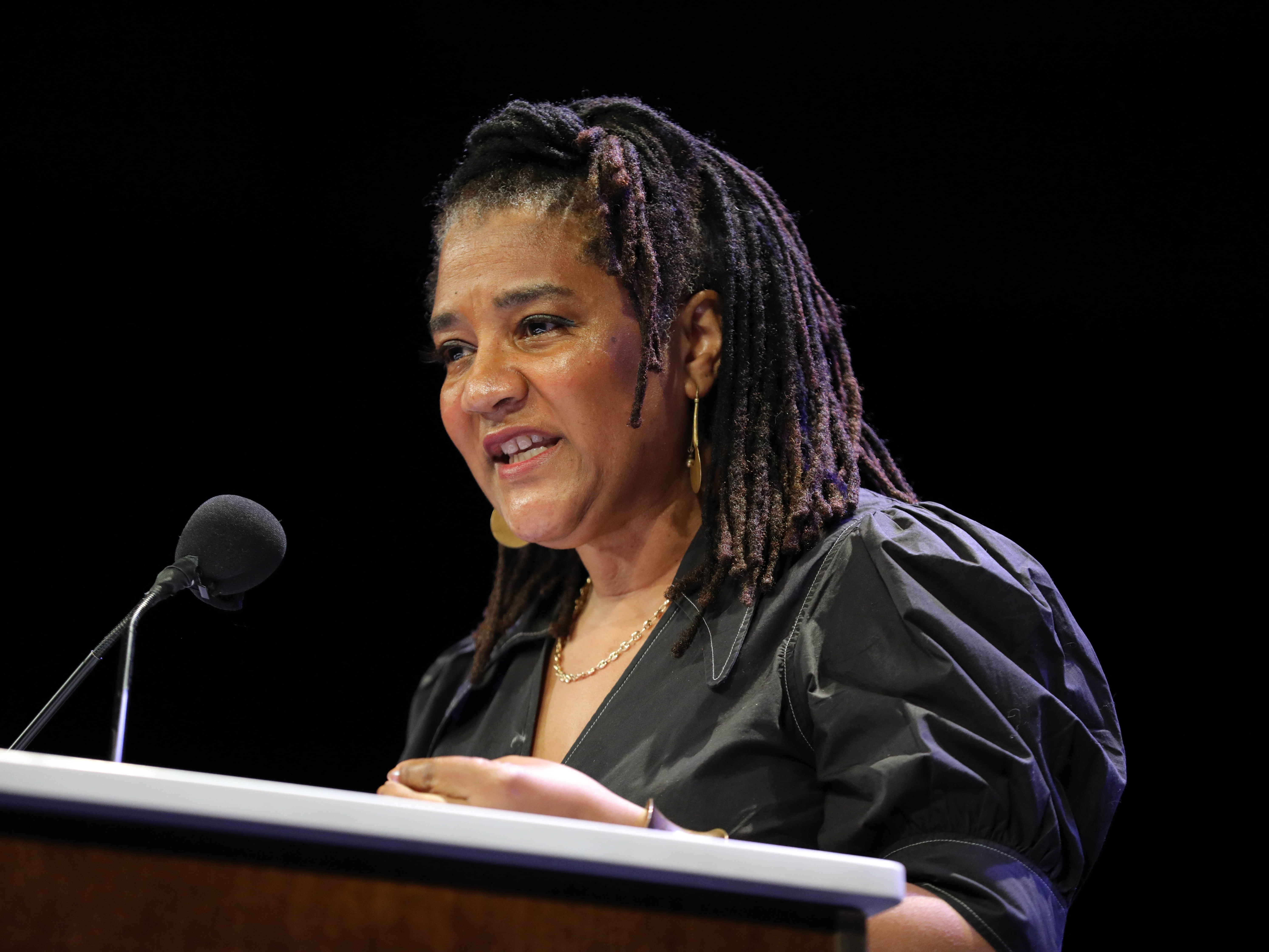 caption: Lynn Nottage onstage in New York City in 2023. Nottage is one of the organizers of the "Fall of Freedom" creative protest.