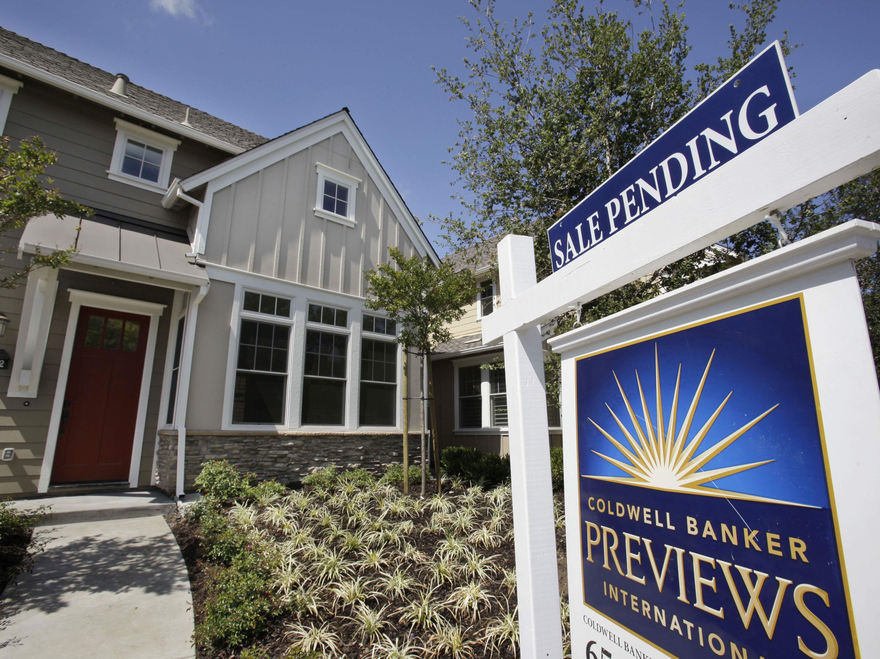 caption: A record shortage of homes for sale and strong demand from buyers is sparking bidding wars and sending home prices to new records.