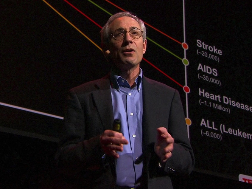caption: Thomas Insel on the TED stage.