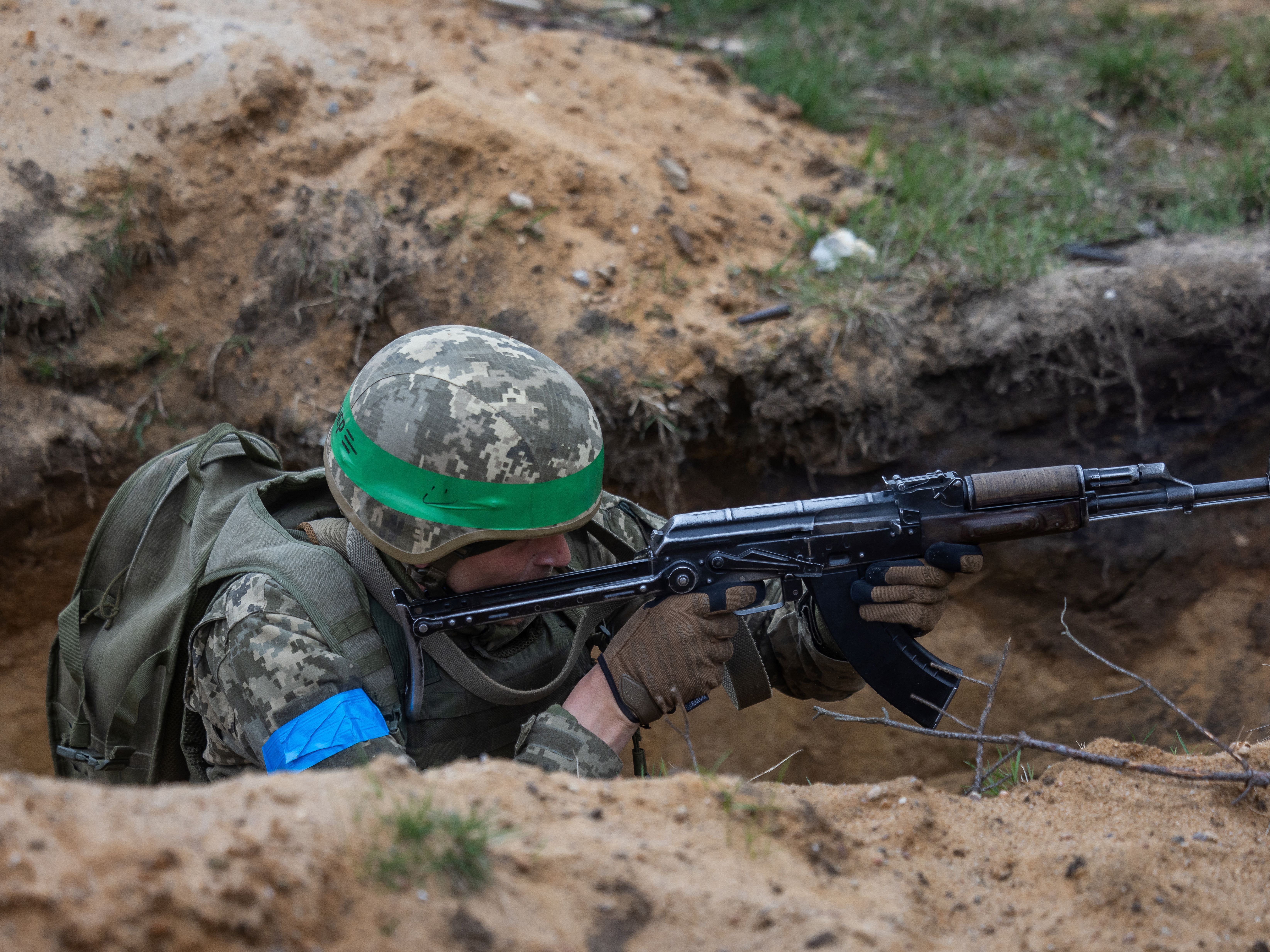 caption: A Ukrainian soldier takes part in a military training with French troops at a military training compound in Poland on April 4.