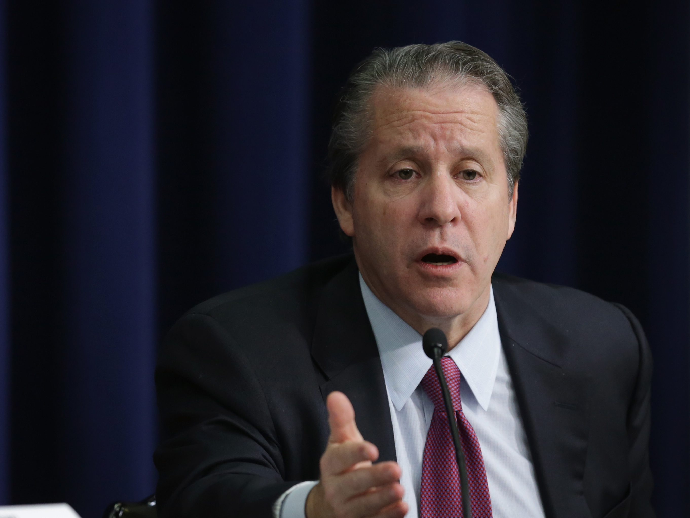 caption: Gene Sperling at a news conference in 2014 in Washington, D.C.