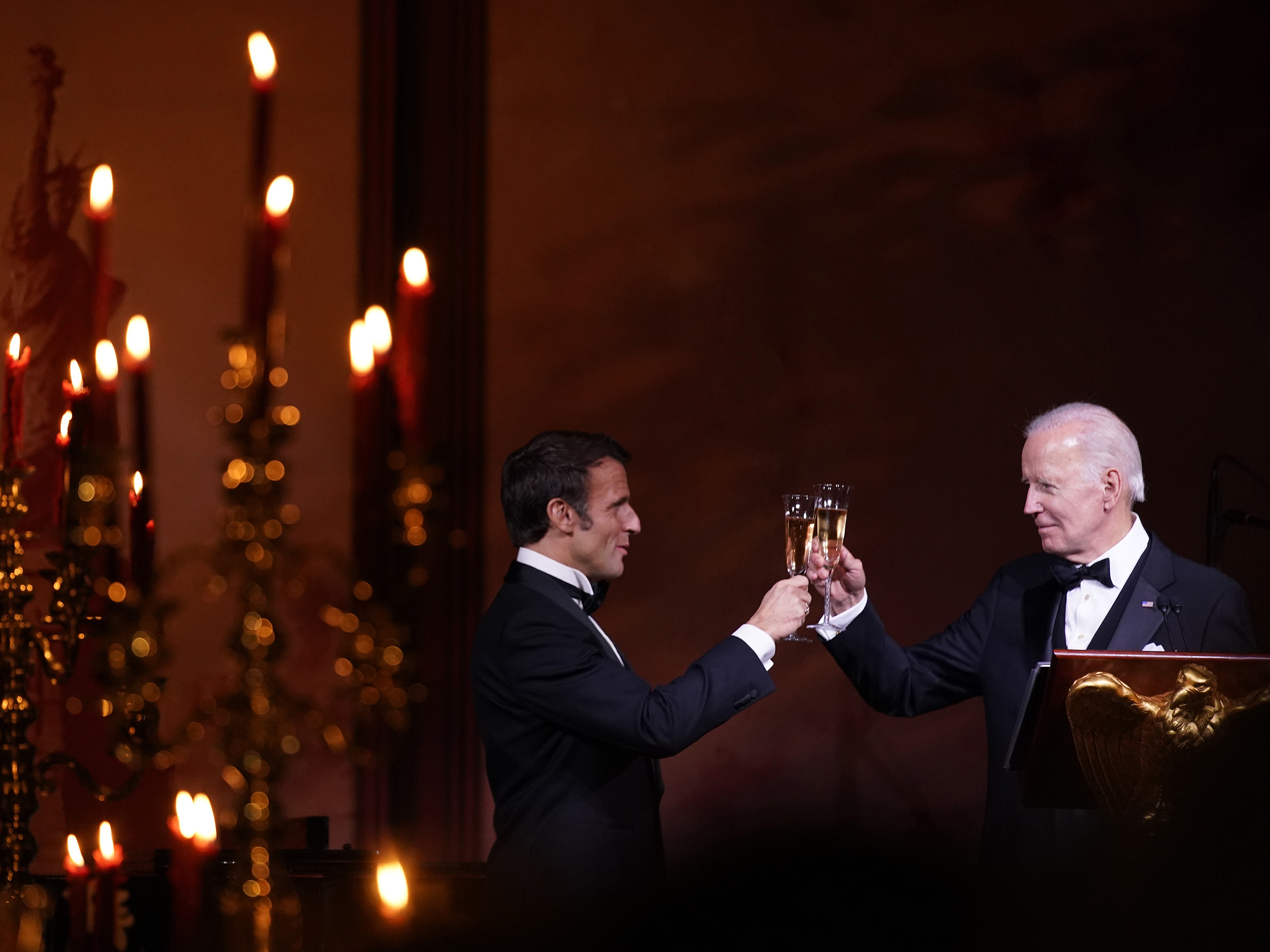 caption: President Biden and French President Emmanuel Macron toast during a state dinner on the South Lawn of the White House in Washington, D.C., on Thursday.