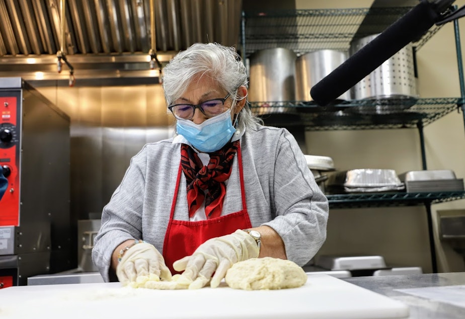 caption: Cecile Hansen, Chairwoman of the Duwamish Tribe, shapes a piece of dough to make traditional frybread.