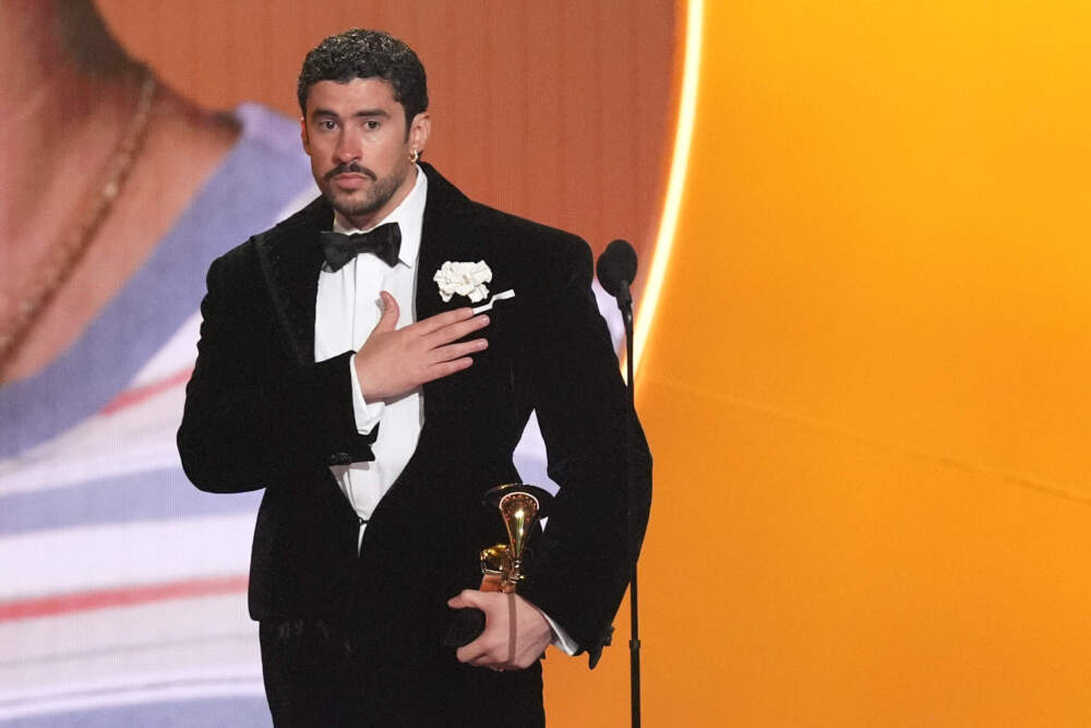 caption: Bad Bunny accepts the award for album of the year for "Debí Tirar Más Fotos" during the 68th annual Grammy Awards on Sunday, Feb. 1, 2026, in Los Angeles. (Chris Pizzello/AP)