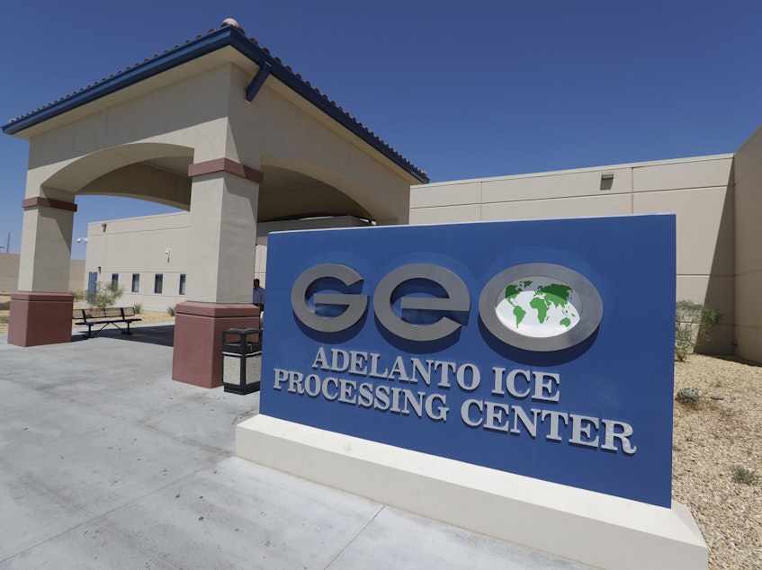 caption: The Adelanto U.S. Immigration and Enforcement Processing Center in Adelanto, Calif., is operated by GEO Group, Inc., a Florida-based company specializing in privatized corrections. The facility is one of 39 recommended by the ACLU for closure.