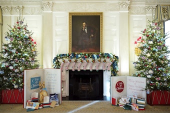 caption: The State Dining Room of the White House is decorated for the holiday season with stockings for family members of President Biden and First Lady Jill Biden.