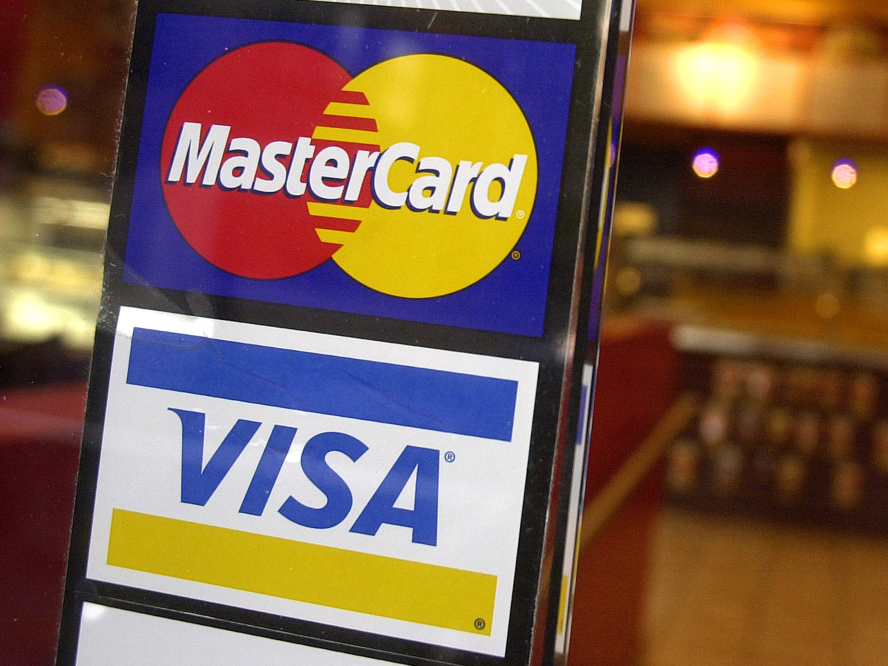 caption: Visa and MasterCard announced, Tuesday, March 26, 2024, a settlement with U.S. merchants related to swipe fees, a development that could potentially save consumers tens of billions of dollars.