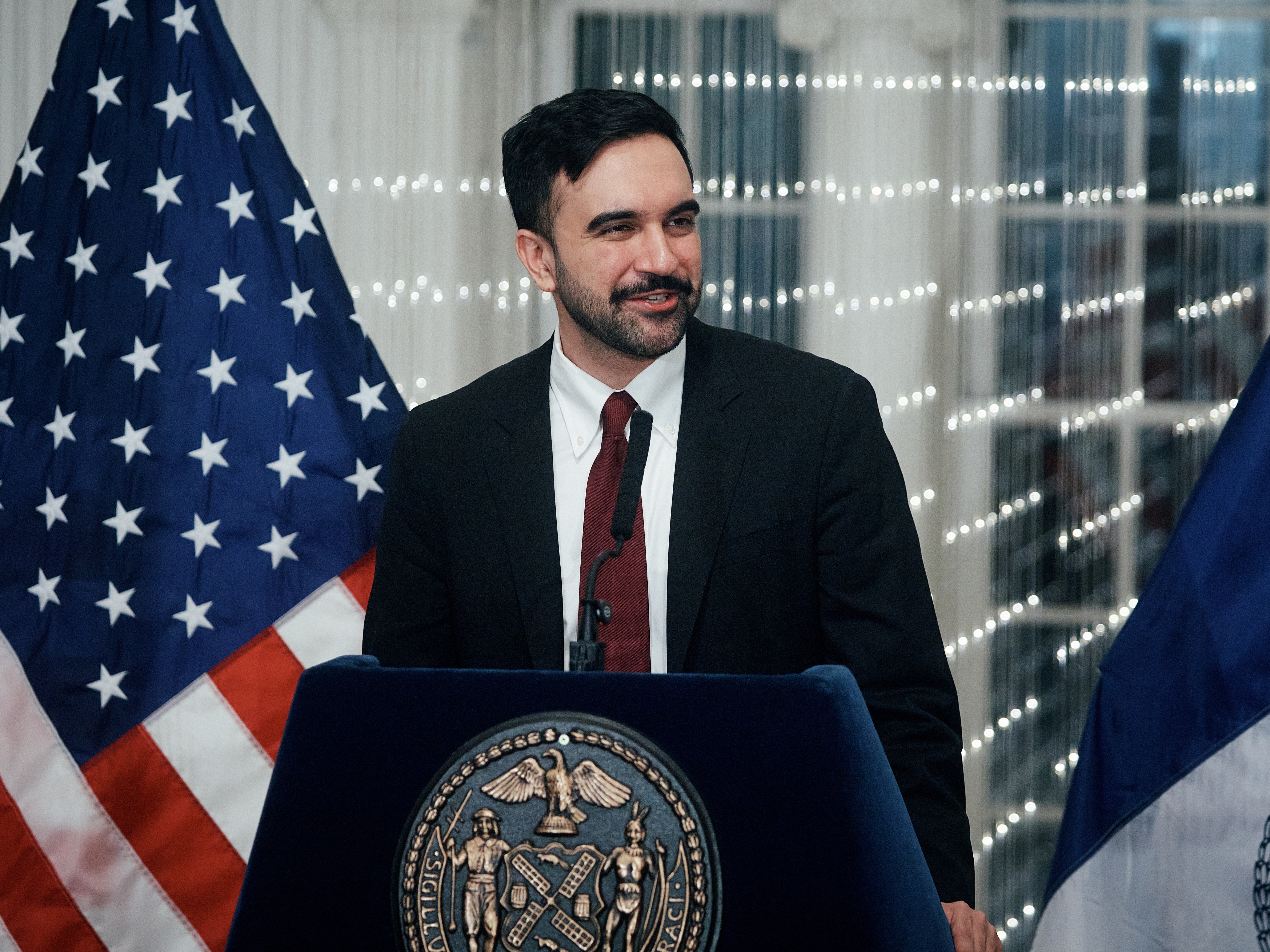 caption: New York City Mayor Zohran Mamdani speaks to city workers during a Ramadan iftar meal at the Museum of the City of New York on Thursday in New York.