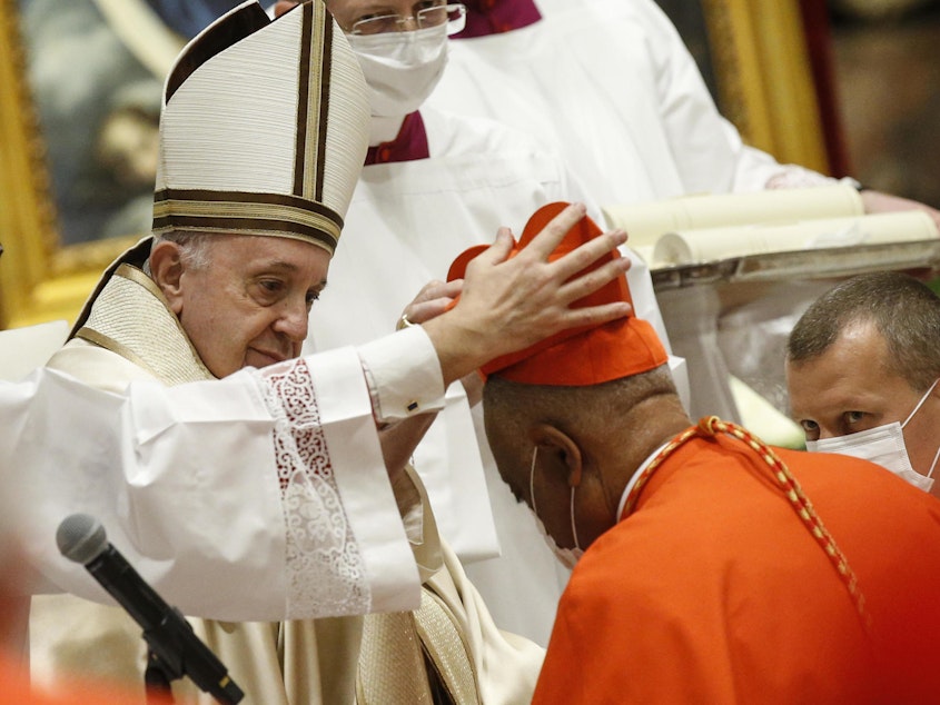 caption: Archbishop Wilton Gregory of Washington, D.C., becomes a cardinal during a ceremony Saturday known as a consistory in St. Peter's Basilica at the Vatican. Pope Francis cautioned new cardinals never to lose their connection to the people.