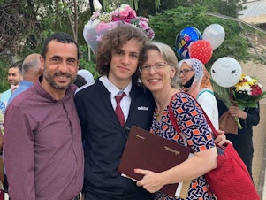 caption: Hisham Awartani with his father, Marwan Awartani, and mother, Elizabeth Price. On Saturday, Awartani was one of three men of Palestinian descent shot in Burlington, Vermont.
