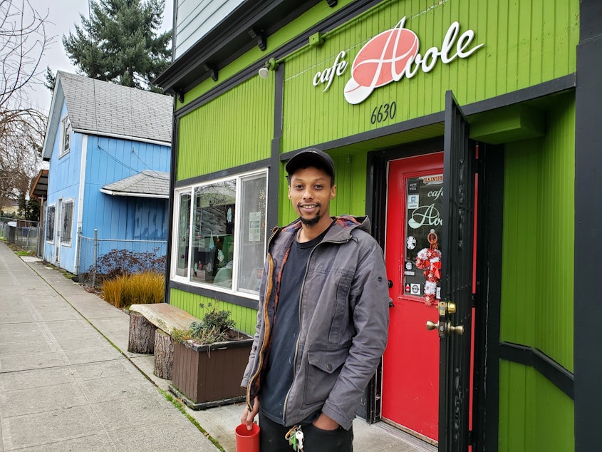 caption: Solomon Dubie, owner of the Cafe Avole, is too worried about speeding cars to put out tables and chairs in front of his cafe.