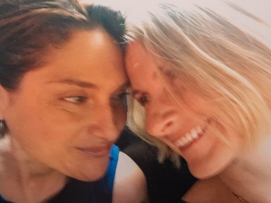 caption: "We used to call each other ... 'my person,'" Gilbert (right) says of Elias.