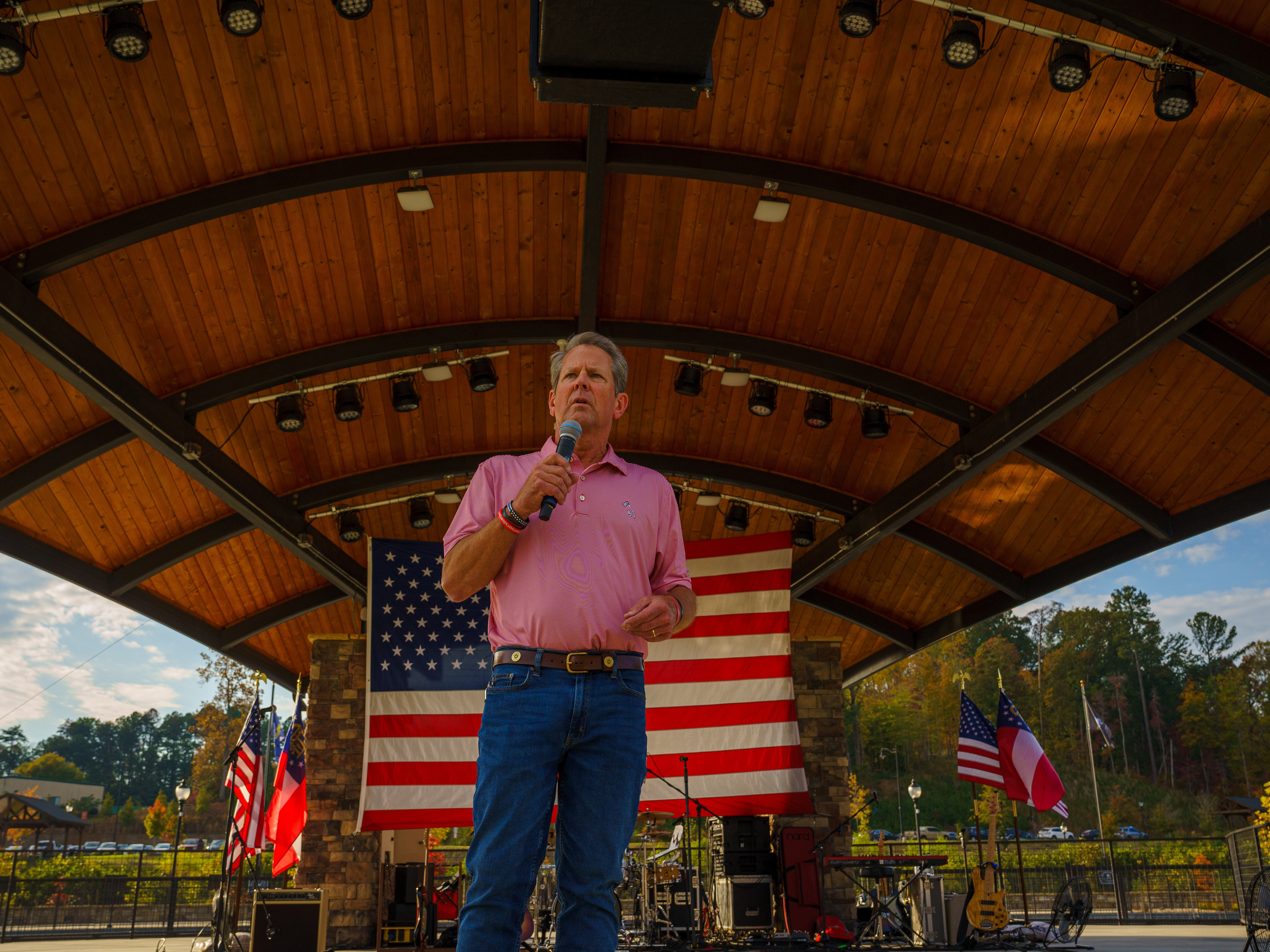 caption: Georgia Gov. Brian Kemp speaks at a Get out the Vote event in Cumming, Ga. on Oct. 26.