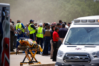 caption: Emergency personnel gather near Robb Elementary School following a shooting, Tuesday, May 24, 2022, in Uvalde, Texas.