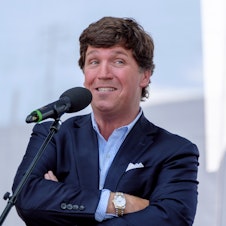 caption: Tucker Carlson speaks at a political event on August 7, 2021 in Esztergom, Hungary. Carlson, who was fired from Fox News last month, announced he is taking his show to Twitter.