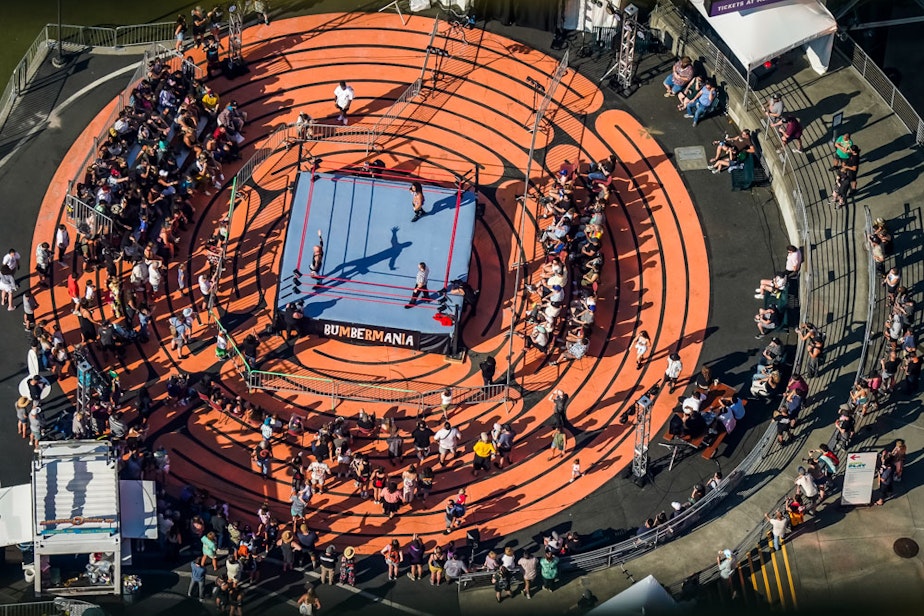 caption: Ariel view of BumberMania, the semi-pro wrestling at Bumbershoot 2023. Located in the Recess District, this event is one of the new additions of this years festival.