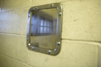 caption: <p>The reflection of a jail cell window is visible in this stainless steel mirror in a Clark County Jail cell in Vancouver, Wash., on March 14, 2019. The mirror is made out of a solid sheet of metal instead of glass.</p>