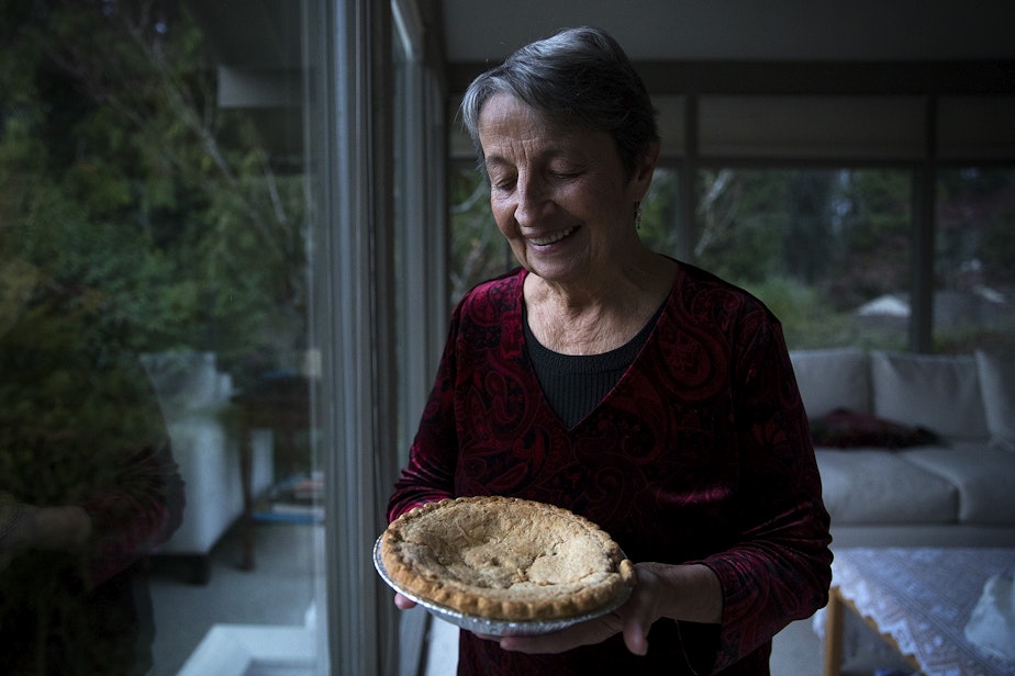 caption: Sheila Kelly holds a mincemeat pie bought by her mother, Helen May Kelly, in 1988, on Friday, November 22, 2019, at her home in Seattle. Her mother died before the pie could be consumed and she has kept it in her fridge ever since.
