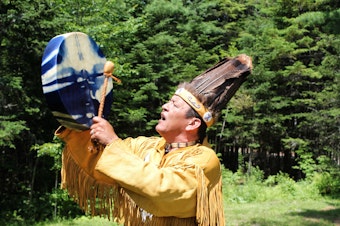 caption: Dwayne Tomah, the youngest fluent Passamaquoddy speaker, sings a Passamaquoddy song outside of his home in Perry, Maine. Tomah is translating and interpreting songs and stories from wax cylinders recorded nearly 130 years ago.