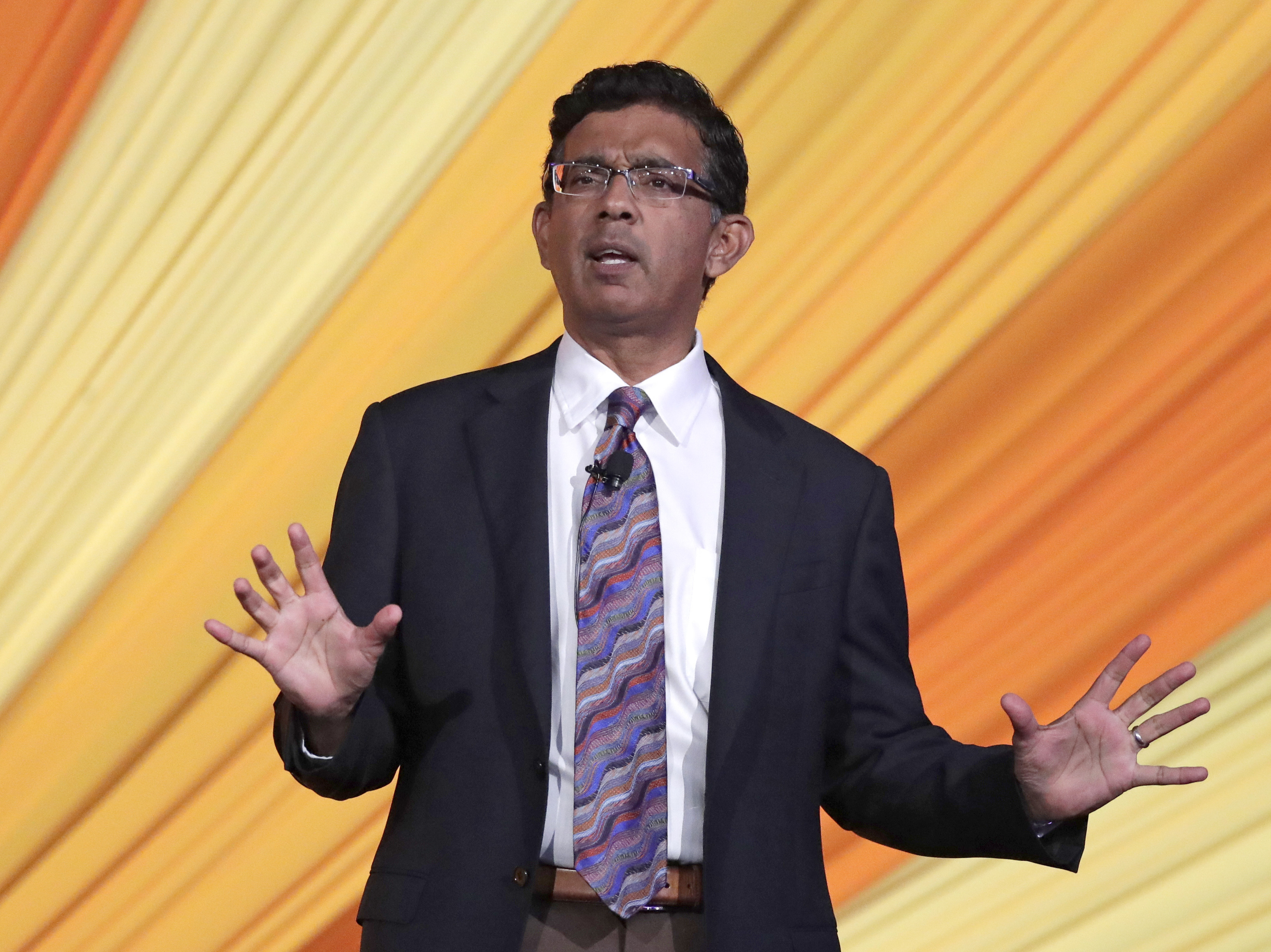 caption: The book version of "2,000 Mules," the latest project from author and filmmaker Dinesh D'Souza, was abruptly recalled due to an unspecified "error."