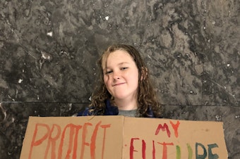 caption: Fifth-grader Theo Sullivan, 11, organized Tacoma students' climate strike on Friday, March 15, 2019.