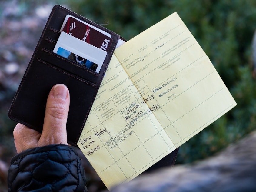 caption: The World Health Organization-approved proof of vaccination form is used these days for yellow fever. It's just a coincidence that the card itself is yellow.