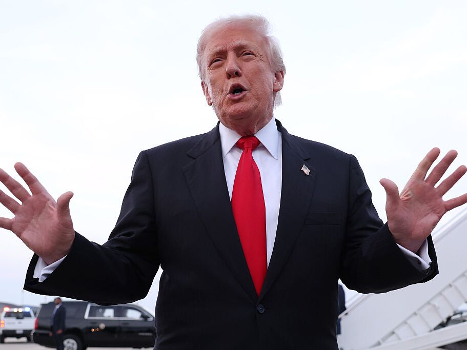 caption: President  Trump speaks to members of the press after exiting Air Force One on Nov. 9 at Joint Base Andrews, Md.