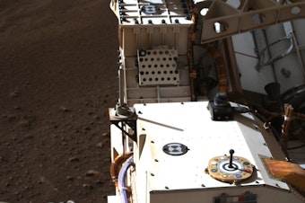 caption: This photo of the Rover includes a view of color chips used to calibrate the images from Mars.