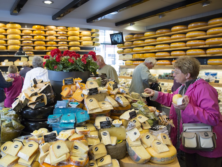 caption: The European Union's highest court has ruled that a food's taste can't be copyrighted. Here, people shop for cheese in Gouda, Netherlands, in 2015.