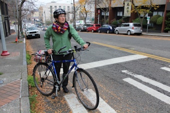 caption: Clara Cantor of Seattle Neighborhood Greenways is one of many stakeholders weighing in as the city's network of protected bike lanes takes shape. Cantor  stands at the top of a long uphill climb on S Main Street. It's part of the city's preferred route for bikes leaving downtown bound South Seattle. 