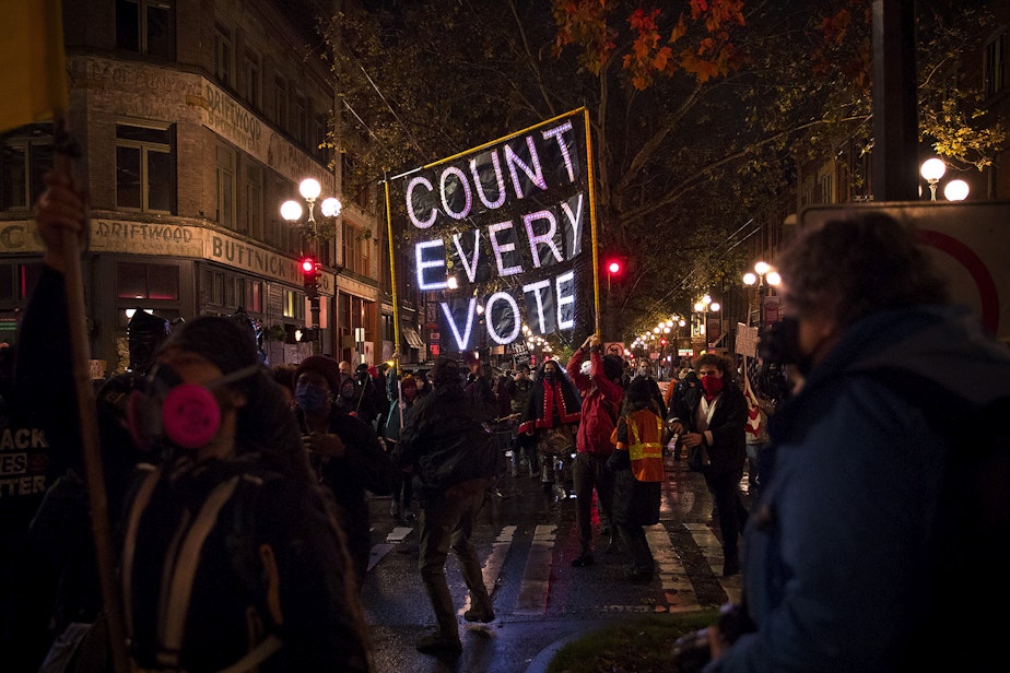 caption: Hundreds marched through Pioneer Square on Wednesday, November 4, 2020, following a rally focused on counting every vote and protecting every person. In addition to supporting ongoing vote counts, speakers called for an investment in Black communities, closing King County’s youth jail and protecting undocumented immigrants. “We are on stolen land, built with stolen labor by people who look like me,” said Trae, an organizer with the Black Action Coalition. 
