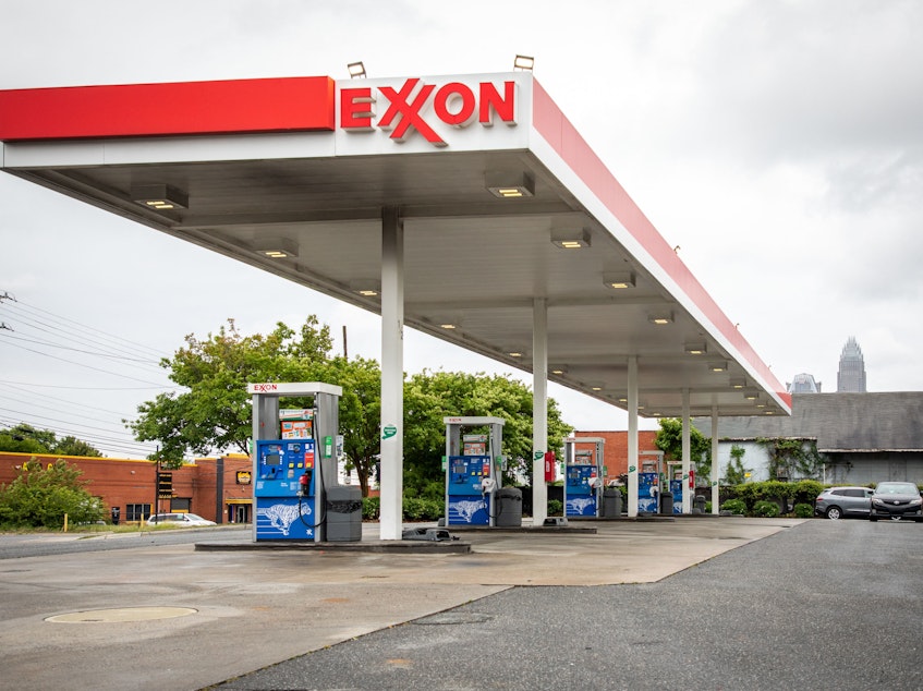 caption: Pictured are pumps at an Exxon gas station in Charlotte, N.C. A tiny fund got two board members elected to the oil giant's board, delivering a historic defeat to ExxonMobil.